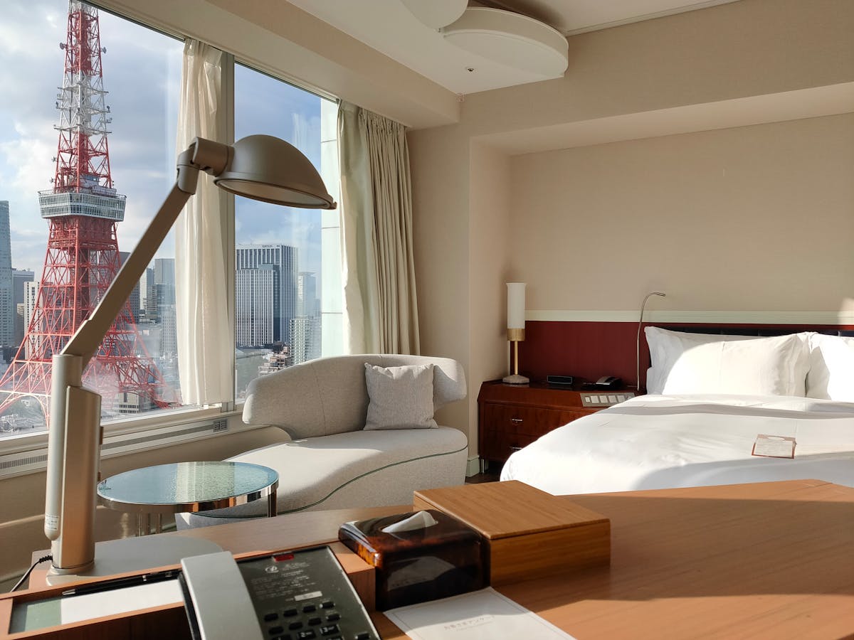 Compact hotel room in Tokyo with Tokyo Tower view at night