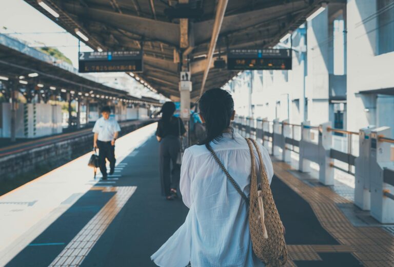 Tokyo train station platform with travelers Japan
