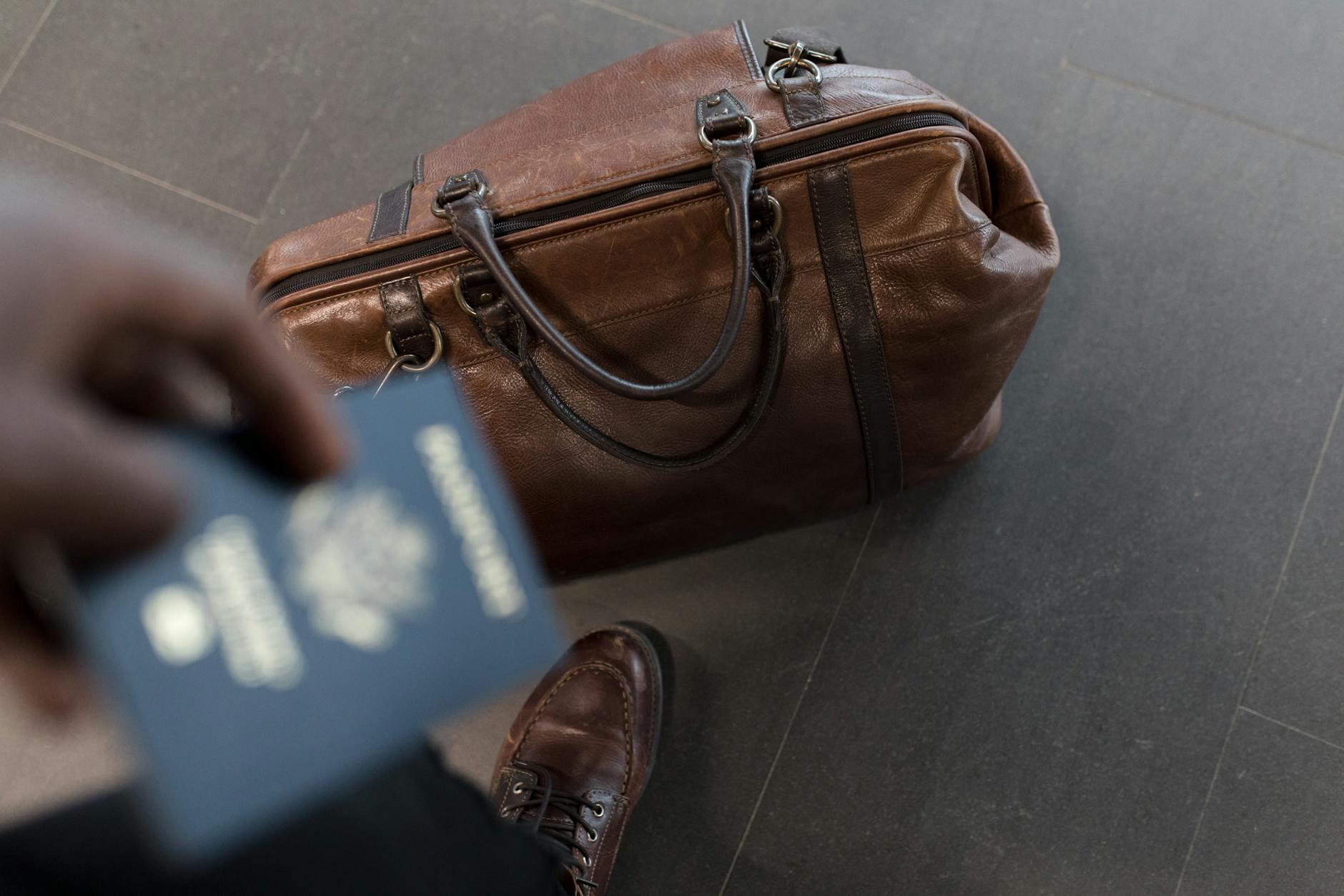 Passport and travel insurance documents on a table for Japan trip planning