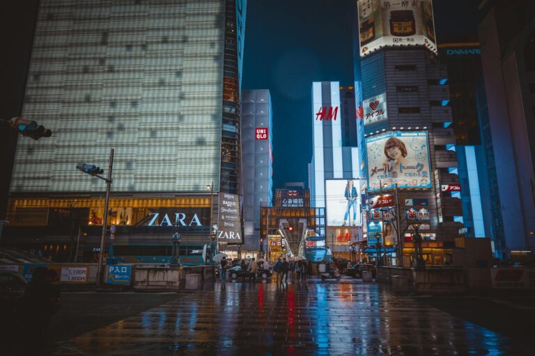 Dynamic cityscape of Osaka at night with bright neon lights and wet streets Japan