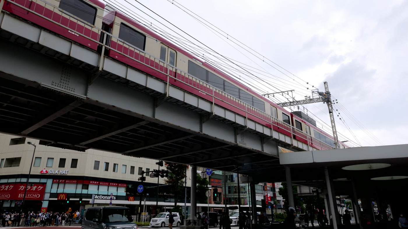 Keikyu train on an elevated line above a Tokyo street